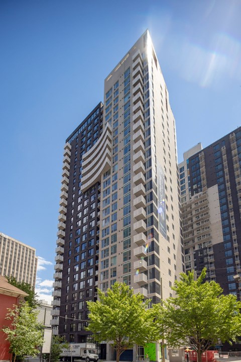 a tall building with an flag on the side of it